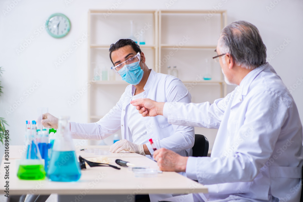 Two chemists working in the lab Two chemists working in the lab