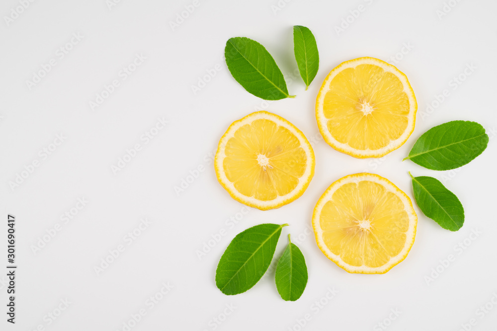 Fresh slice lemon with leaves, vitamin c supplement from natural isolated on white background with copy space Fresh slice lemon with leaves, vitamin c supplement from natural isolated on white background with copy space