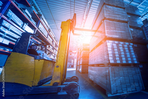 Forklift loader in storage warehouse ship yard. Distribution products. Delivery. Logistics. Transportation.