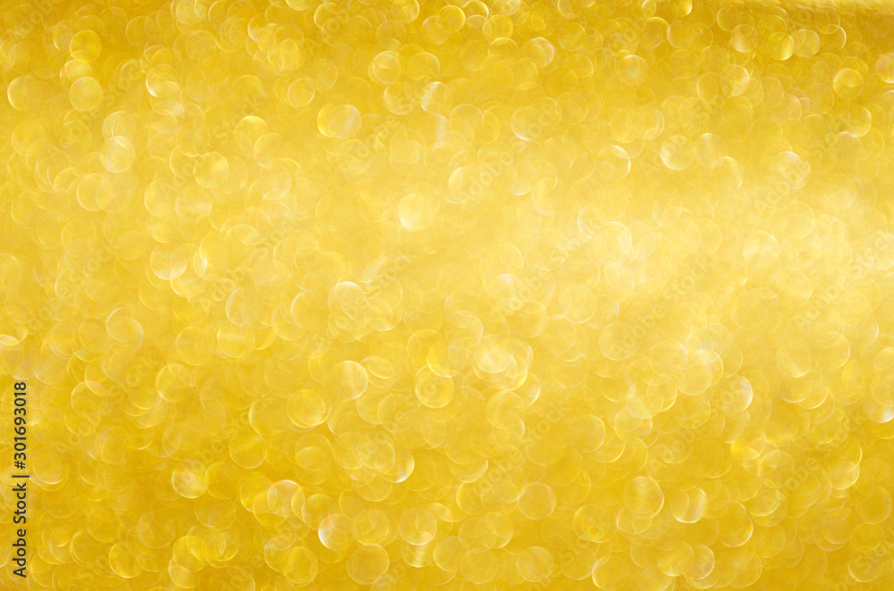 Rich golden sparkle glow bokeh texture as background. Rich golden sparkle glow bokeh texture as background.
