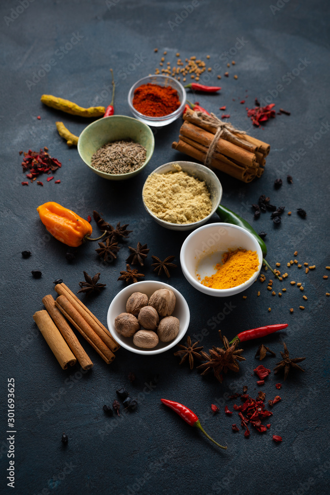 Dark food background with spice in bowls Dark food background with spice in bowls