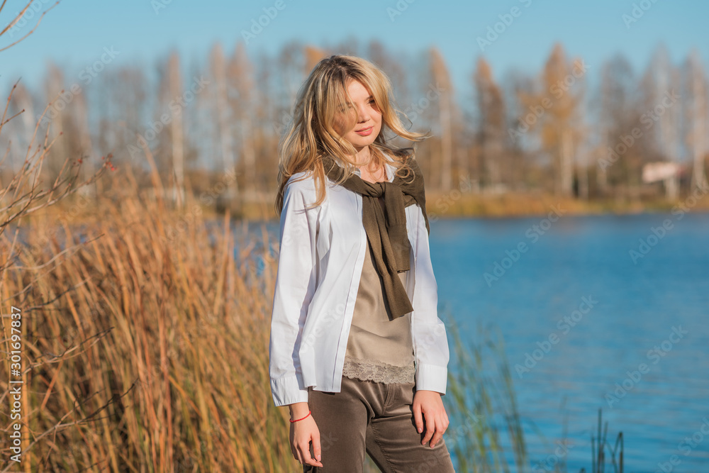Pretty woman, American or European appearance, fashionable concept. Young lady, stylishly dressed at nature .Natural beauty Pretty woman, American or European appearance, fashionable concept. Young lady, stylishly dressed at nature .Natural beauty