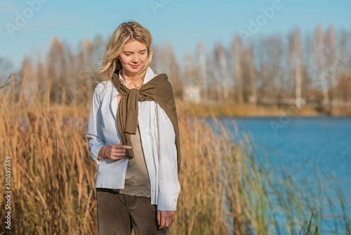Pretty woman, American or European appearance, fashionable concept. Young lady, stylishly dressed at nature .Natural beauty 