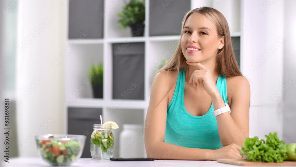 Portrait of smiling young vegan girl posing at white room enjoying healthy lifestyle Portrait of smiling young vegan girl posing at white room enjoying healthy lifestyle