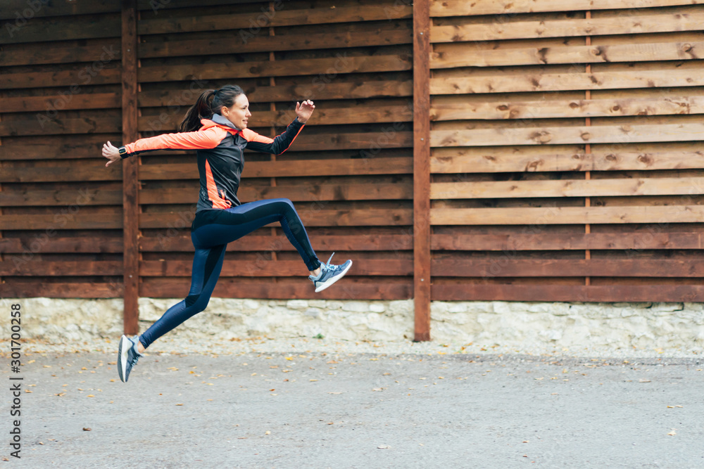 Girl athlete in a high jump. Sport as a way of life. Workout outside. Girl athlete in a high jump. Sport as a way of life. Workout outside.