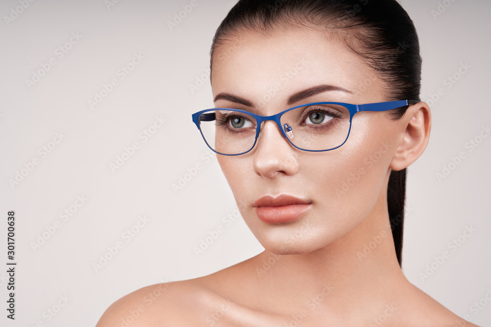 Woman with long eyelashes in eyeglasses. Vision correction. Poor eyesight. Spectacle frame. Makeup, cosmetics, beauty. Close up, macro Woman with long eyelashes in eyeglasses. Vision correction. Poor eyesight. Spectacle frame. Makeup, cosmetics, beauty. Close up, macro