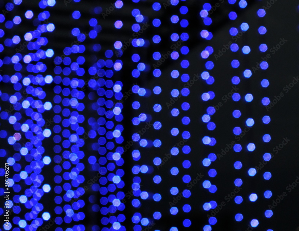 Blue bokeh background of defocused glittering lights. Blue bokeh background of defocused glittering lights.