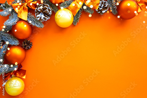 Christmas composition. Background orange colors with decorations. Christmas, winter, new year concept. Flat lay, top view, copy space .