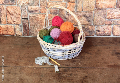 Balls of wool for knitting in a wicker basket