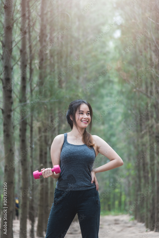 Sport young woman girl lifestyle exercise holding fitness dumbbell workout Sport young woman girl lifestyle exercise holding fitness dumbbell workout