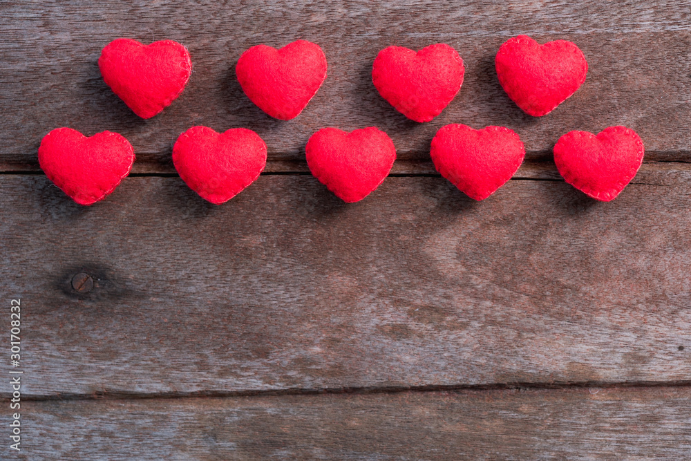 Fototapeta premium Fabric red heart on wooden background