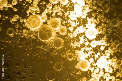Biodiesel, bubbles biofuel, vegetable oil, yellow and orange emulsion bubbles background
