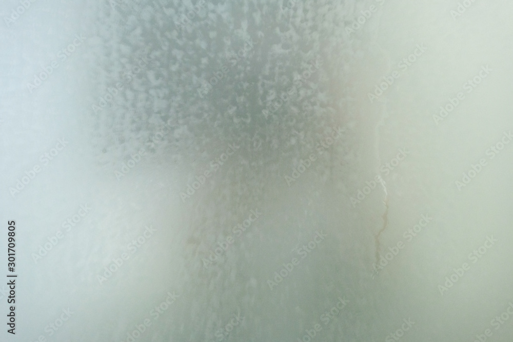 Steam on the glass in shower room, blurry steam on mirror in shower