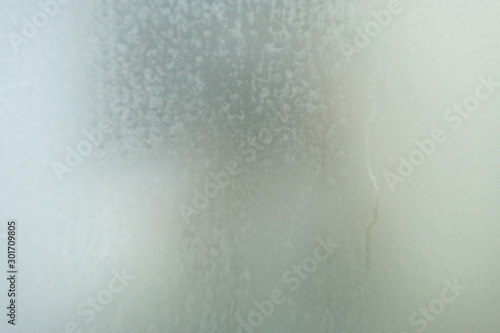Steam on the glass in shower room, blurry steam on mirror in shower room