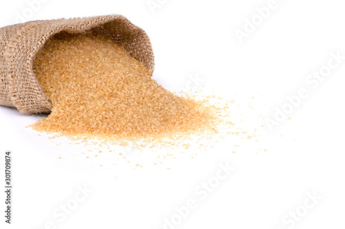 Obraz na plátne Closeup brown sugar in sack isolated on white background.
