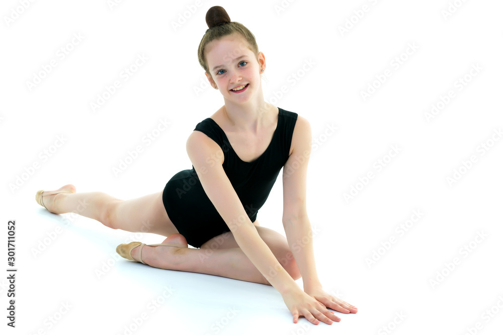 The gymnast perform an acrobatic element on the floor. The gymnast perform an acrobatic element on the floor.