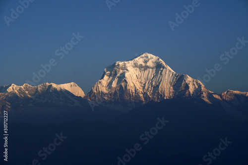 Landscape Nature himalaya rang mountain view of closeup Mt. Dhaulagiri massif.Dhaulagiri I is the seventh highest mountain in the world at 8,167 metresas seen from Poon Hill, Nepal - trekking route photo