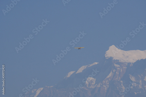 Annapurna Himalayas with dhaulagiri and machapuchare mountain with fog and blue sky seen from pokhara north central Nepal - Background texture concept 