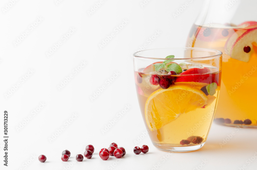 Spiced apple mocktail with mint and cinnamon. White background Spiced apple mocktail with mint and cinnamon. White background