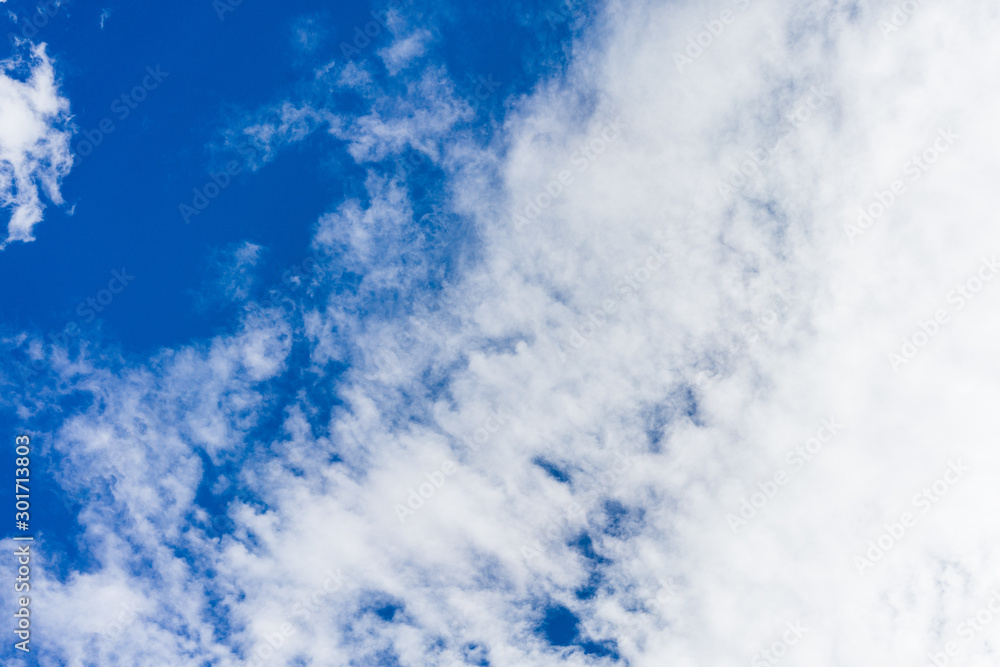 Blue sky on a sunny day with fluffy clouds Blue sky on a sunny day with fluffy clouds