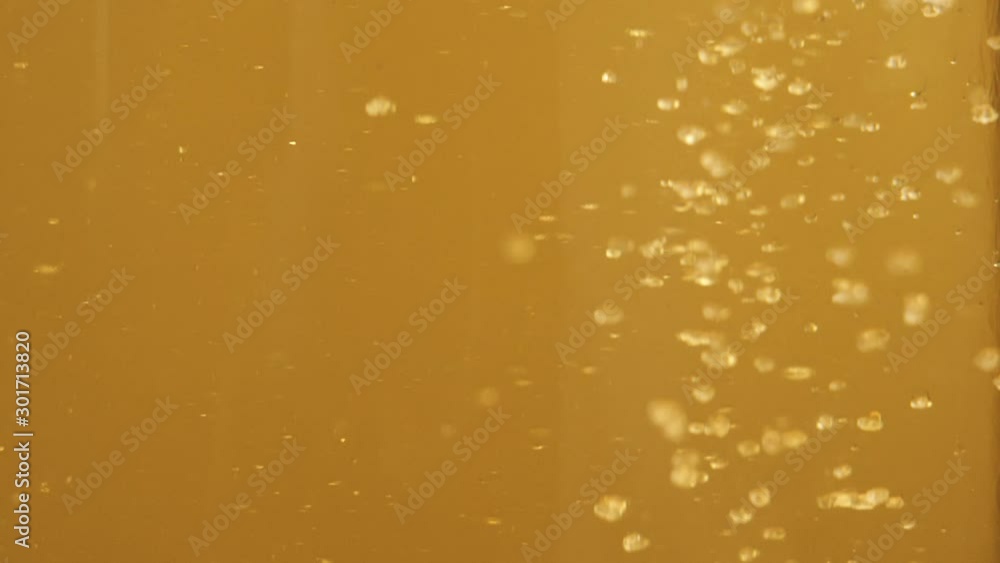 Tea ceremony. Sugar is poured into a transparent glass with ice cubes, lime slice and mint on table against bright background. Modern cold Chinese ceremony. Close up. Side view Tea ceremony. Sugar is poured into a transparent glass with ice cubes, lime slice and mint on table against bright background. Modern cold Chinese ceremony. Close up. Side view