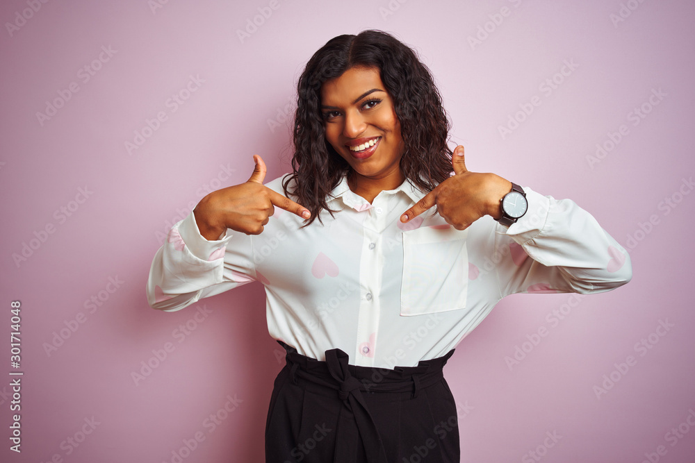 Transsexual transgender businesswoman standing over isolated pink background looking confident with smile on face, pointing oneself with fingers proud and happy.