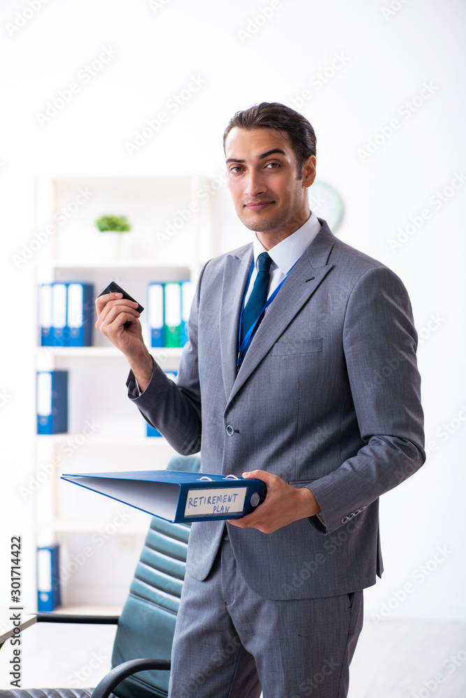 Young male accountant working in the office Young male accountant working in the office