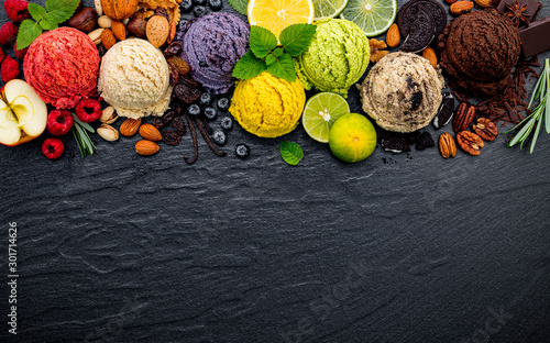 Tela Various of ice cream flavor ball blueberry ,lime ,pistachio ,almond ,orange ,chocolate and vanilla set up on dark stone background