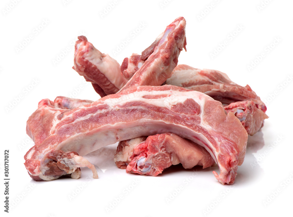 raw pork ribs yet to be cooked on a white background.