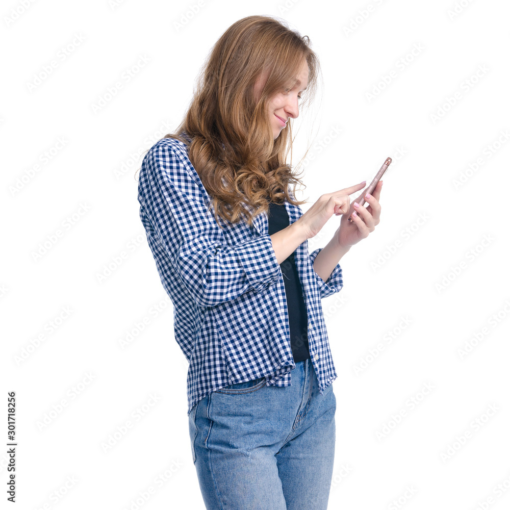 Portrait casual woman with mobile phone in hand standing smiling on white background isolation Portrait casual woman with mobile phone in hand standing smiling on white background isolation