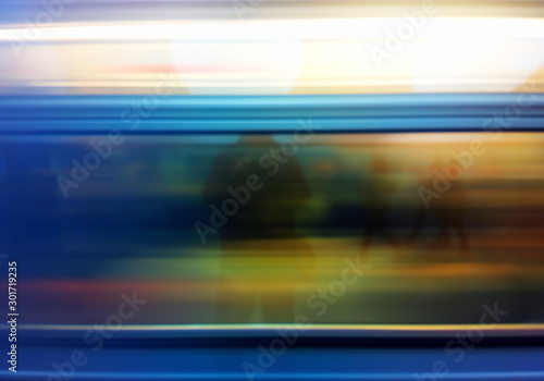 Blurred train in motion with reflection of a man background