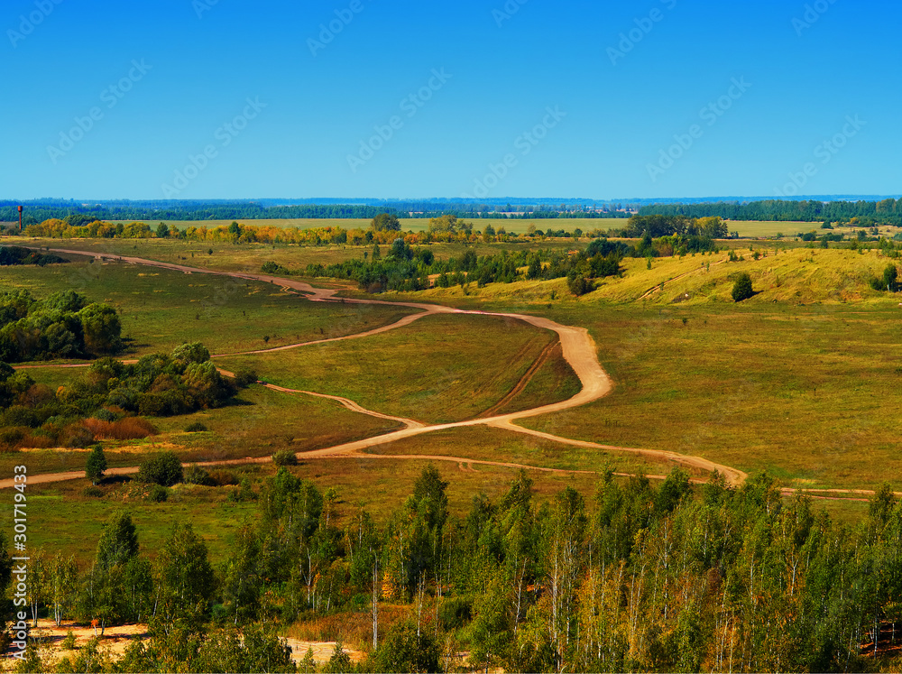 Autumn roads on flatland areal view background