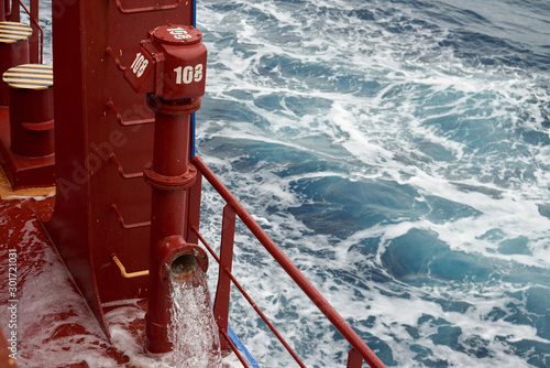 Fotografie, Obraz View of Ballast Water exchange process onboard of a ship using flow-through method underway in open ocean