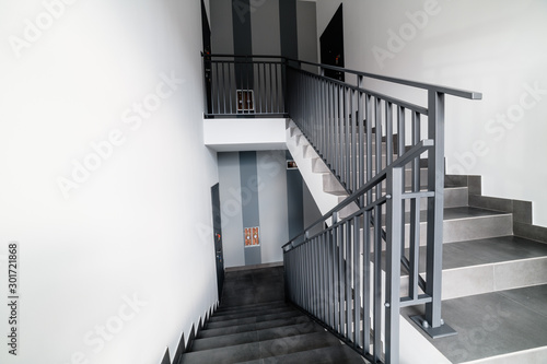 Stairs and handrails in design. Elements of metal on stairs