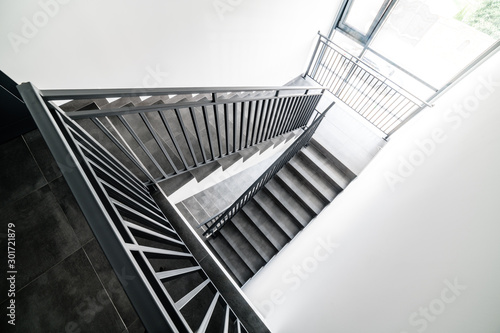 Stairs and handrails in design. Elements of metal on stairs