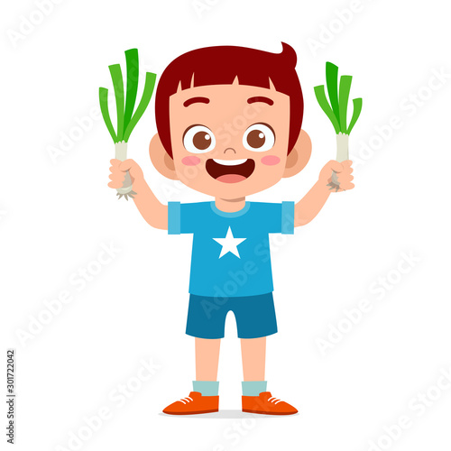happy cute kid boy holding fresh vegetable