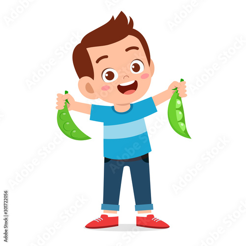 happy cute kid boy holding fresh vegetable
