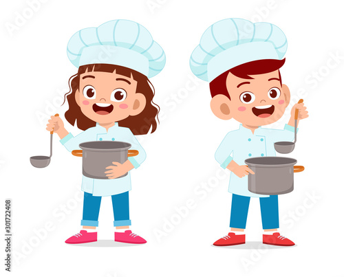 happy cute kid boy and girl in chef costume