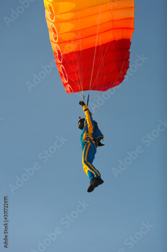 Figure skydiver with a parachute, side view close-up. Parachute jumps. Skydiving.