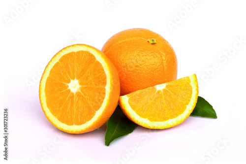 Closeup whole and half ripe fresh  orange frui isolated on white background .