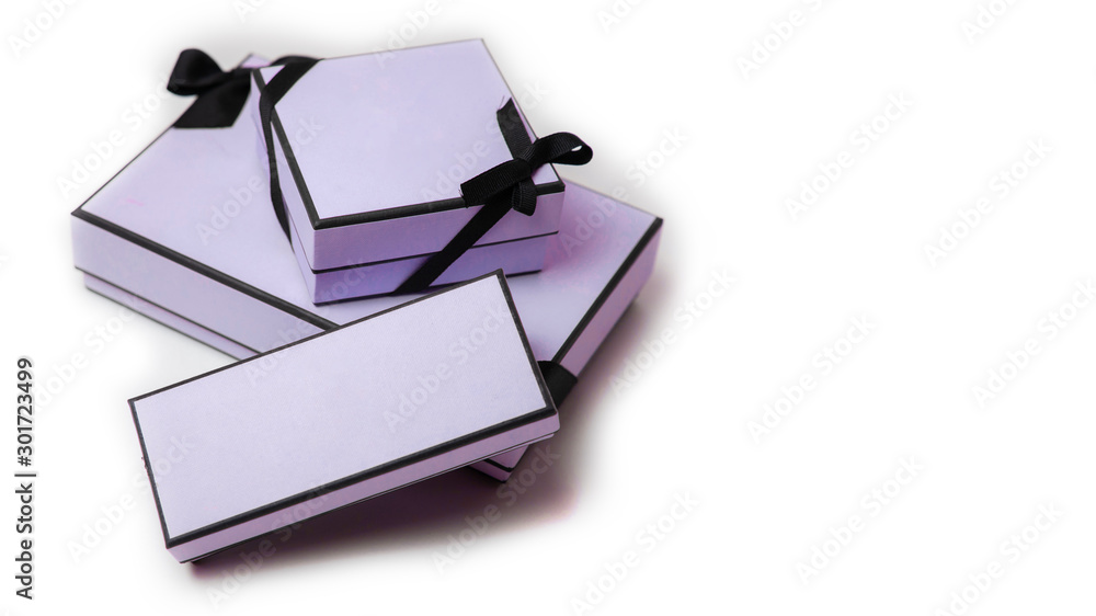 gift boxes with black bow and ribbon on white background