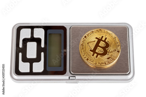 A bitcoin shiner on electronic pocket weight isolated on white background photo