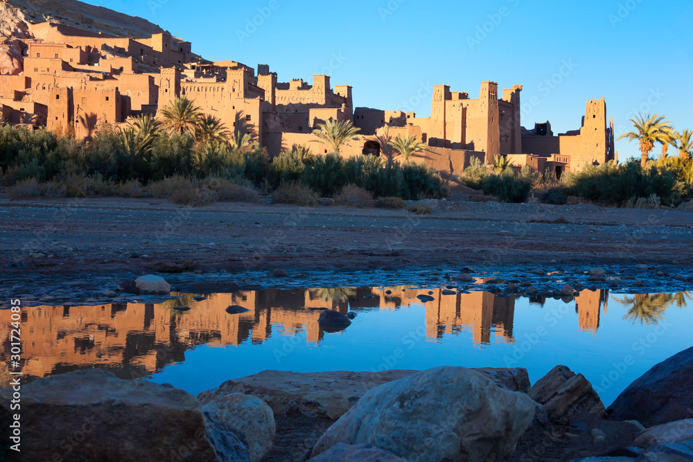 Fototapeta premium Kasbah Ait Ben Haddou with reflection in the river.