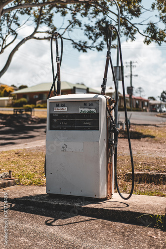 Laurieton Seafoods, Laurieton, NSW Australia - October 20th 2019: Vintage looking old fuel pump outside of Laurieton Seafoods on a sunny day. photo