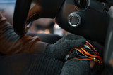 Professional car thief hacking ignition lock