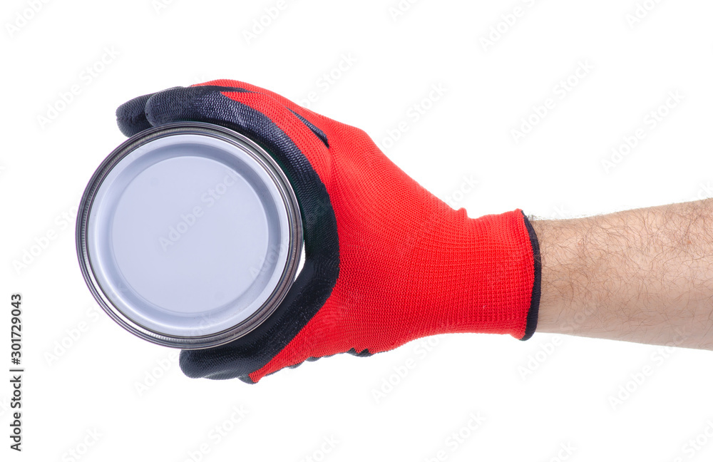 Jar of white paint in male hand on white background isolation Jar of white paint in male hand on white background isolation