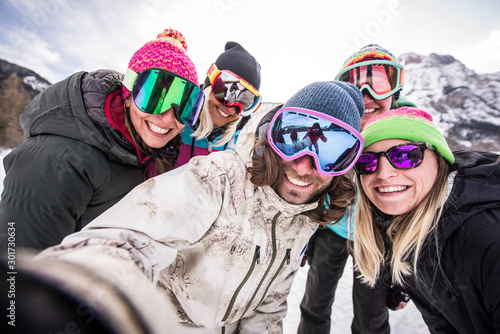 Group of snowboarders on winter holiday © oneinchpunch