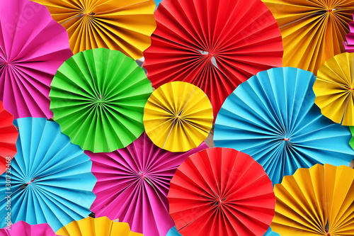 umbrella of beautiful colorful paper filigree strips folded for background