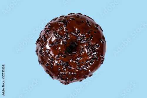 Tasty chocolate donut on a blue background
