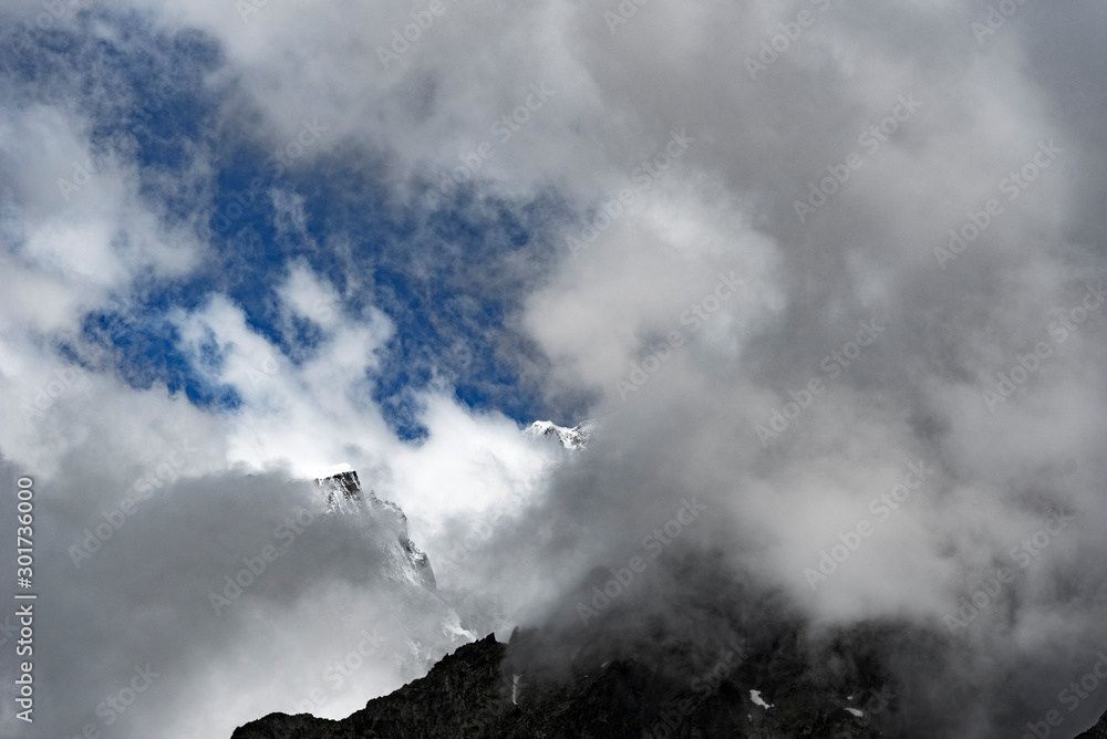 Clouds over italian Alps in Mont Blanc surroundings.